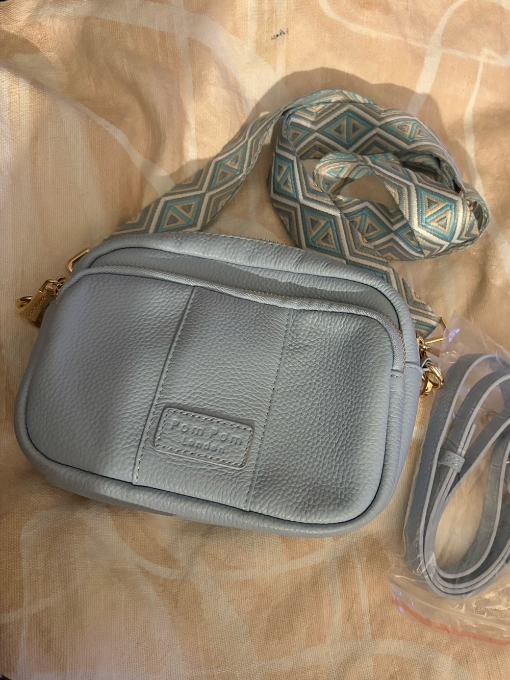 Pom Pom London Light Blue Crossbody Bag with Decorative Strap -